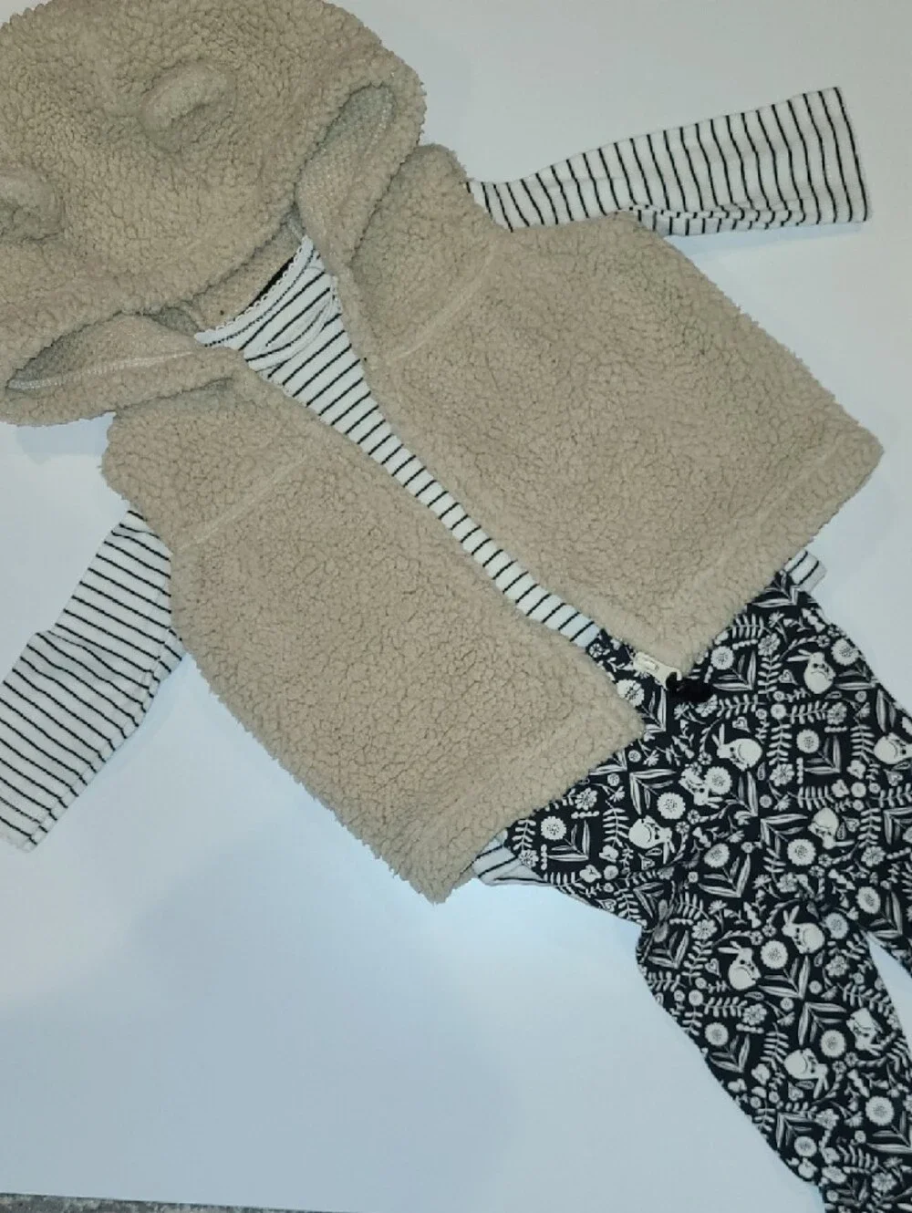 Carters Beige Sherpa Hooded Baby Vest w/ Striped Top & Patterned Leggings.